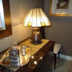 A beautiful table lamp stands in a room