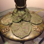 Antique vintage lamp stand on a glass table