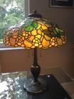 Orange colored abstract designed antique vintage lamp on day time